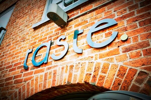 taste brickwall metal logo